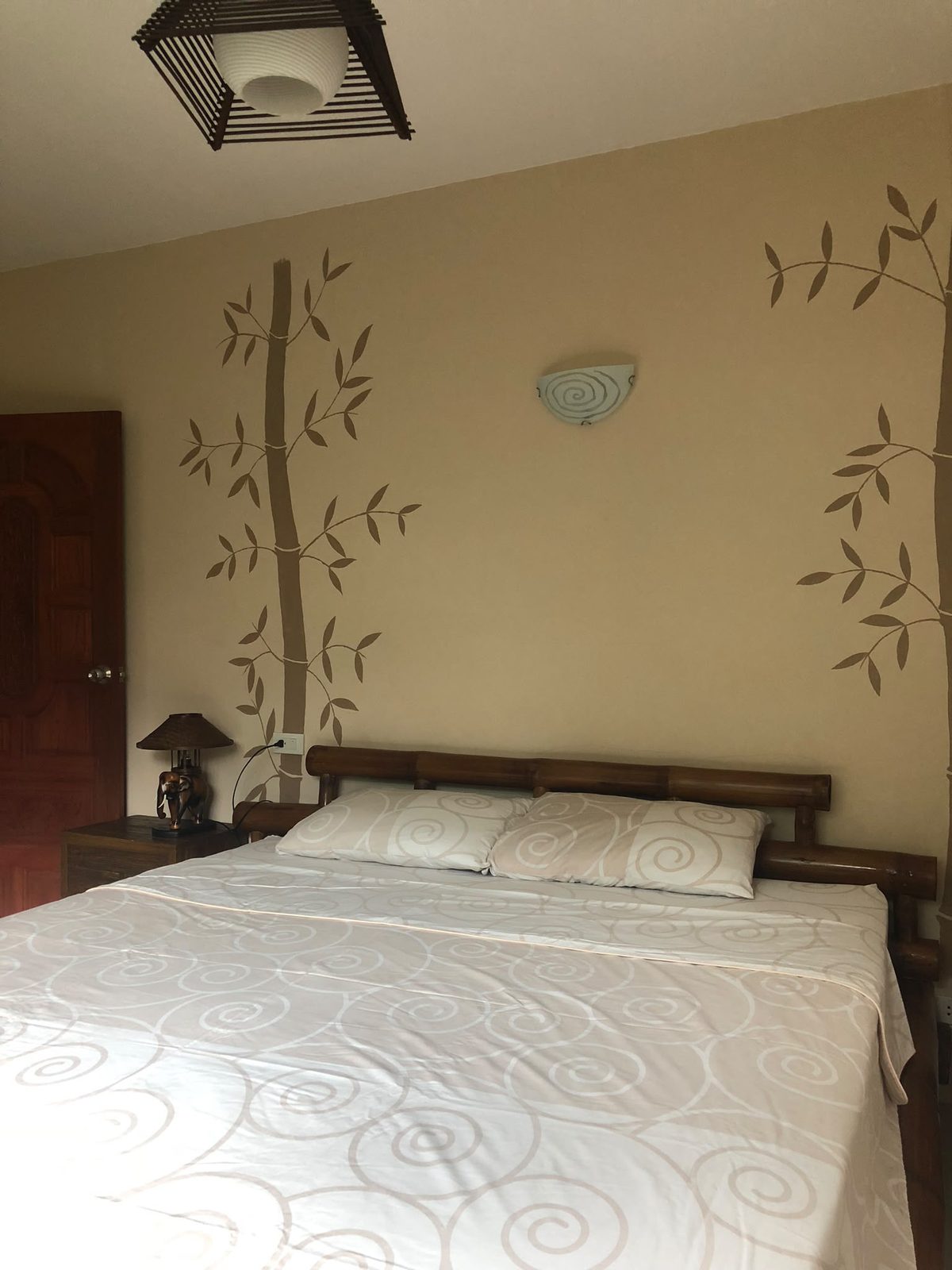 Upper floor second bedroom with bamboo wall decoration